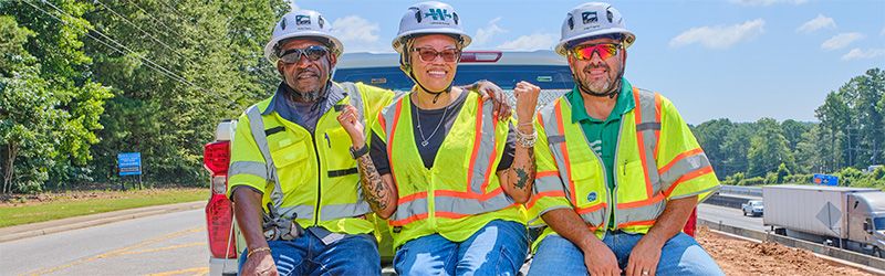 3 Georgia Highway road workers smiling